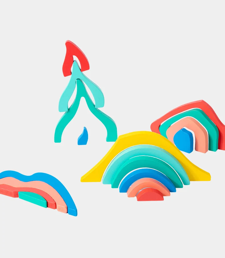 A collection of colorful wooden rainbow blocks in shades of red, orange, yellow, green, and blue.