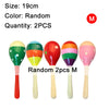 Four wooden sand hammers of various colors and finishes, including red, green, orange, and pink.