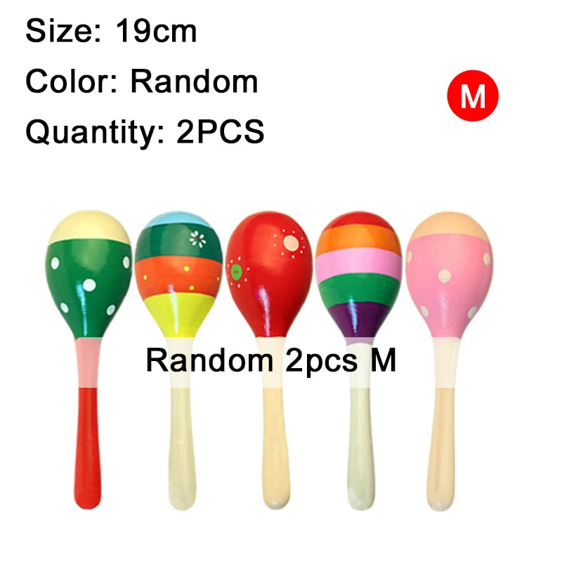 Four wooden sand hammers of various colors and finishes, including red, green, orange, and pink.