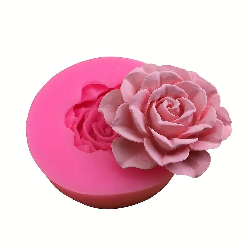 A pink silicone mold shaped like a rose flower for crafting candles, soap, and clay.