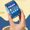 A hand holds a blue 3D rotating slide puzzle cube with colorful plastic balls, showing the rotating mechanism.
