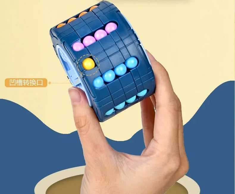 A hand holds a blue 3D rotating slide puzzle cube with colorful plastic balls, showing the rotating mechanism.