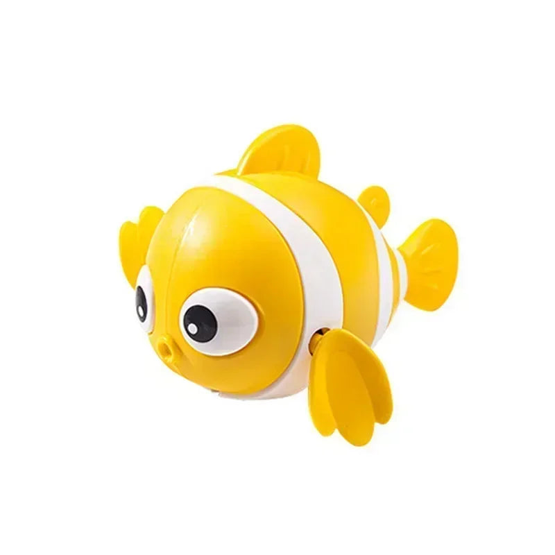Gelbes und weißes Uhrwerk-Fischbadspielzeug für Babys.