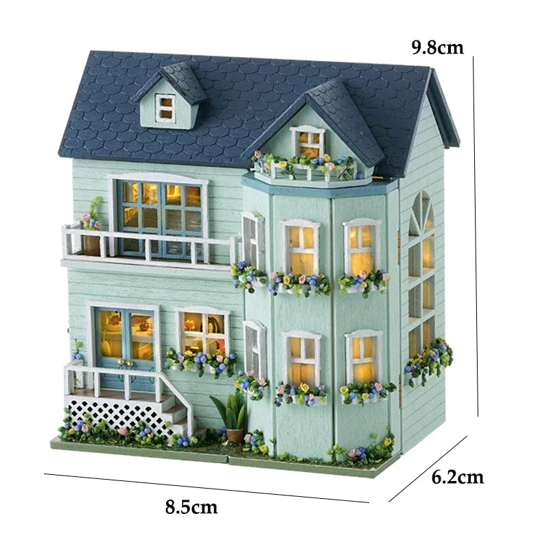 A miniature wooden dollhouse kit of a pink princess villa with decorative windows and LED lights.
