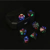 A set of rechargeable LED glow dice, including a d20 and a d6, displayed on a black surface.