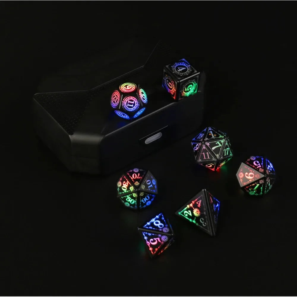 A set of rechargeable LED glow dice, including a d20 and a d6, displayed on a black surface.