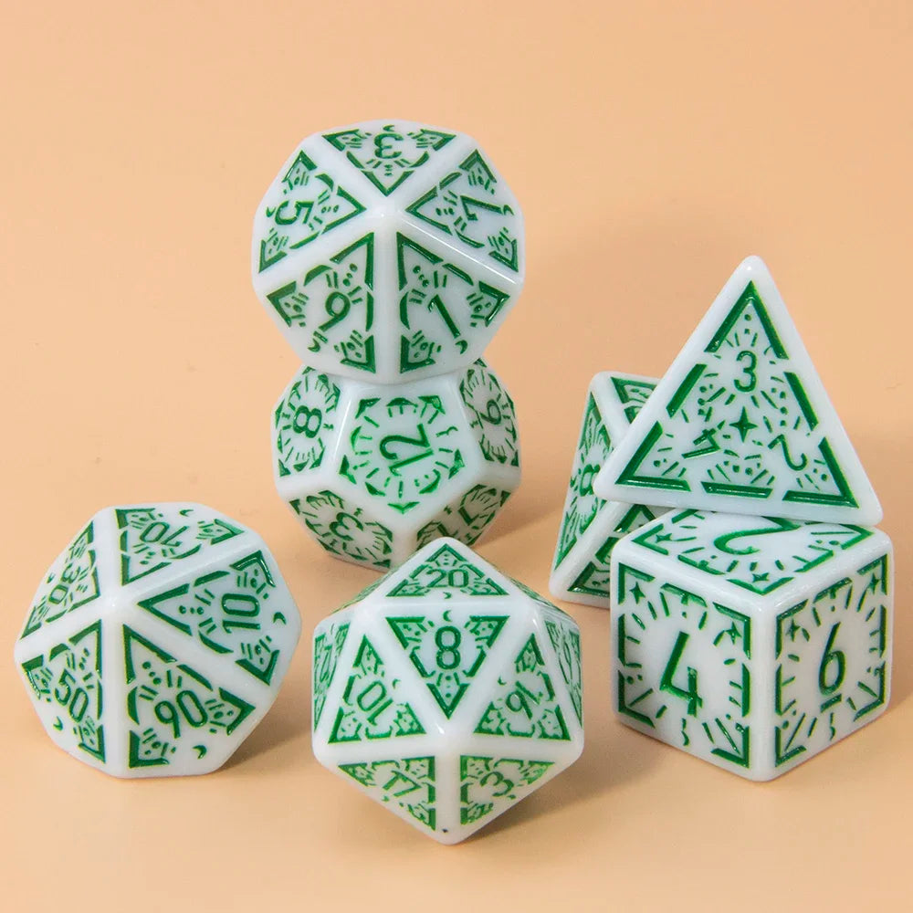 A set of seven polyhedral dice in white and green patterns arranged on a light brown surface.