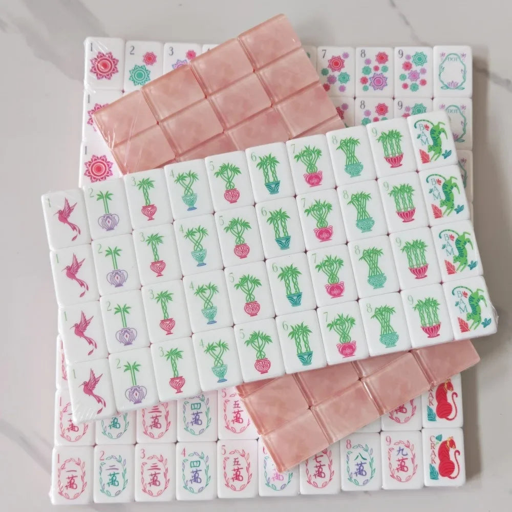 A set of pearl pink acrylic American Mahjong tiles arranged in multiple layers.
