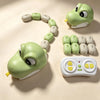 A green magnetic snake toy is shown coiled on a light background with several segmented pieces and a remote control.