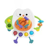 A white owl-shaped sensory toy for babies with colorful silicone pull strings and teethers.