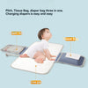 A baby is shown using a multi-functional changing mat that includes a diaper bag, tissue bag, and urine pad.