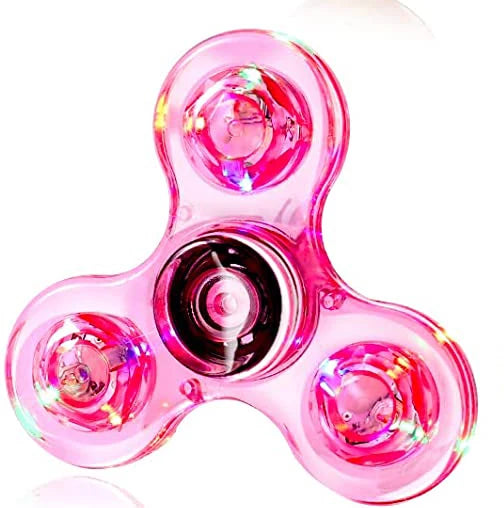A pink glow-in-the-dark LED fidget spinner with a translucent, multi-faceted design.