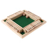 A wooden game board for a four-player dice game with numbered wooden blocks and dice inside.
