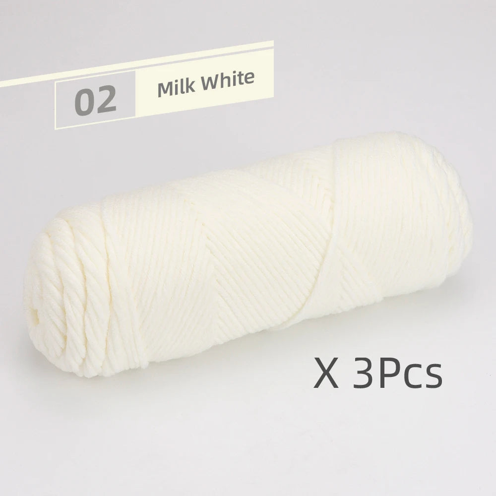 A spool of milk white soft cotton blend yarn for knitting and crochet, packaged as a 3-pack.