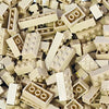 A bulk set of light beige building blocks scattered randomly.