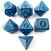 A set of polyhedral dice in blue and black, including d12s, d20s, d10s, d8s, and a d6.