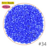 A pile of 5mm blue plastic beads, packaged in a kit for crafting and pixel art puzzles.