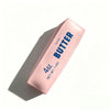 A pink squeeze bottle of salted butter with a label indicating 4 oz net weight.