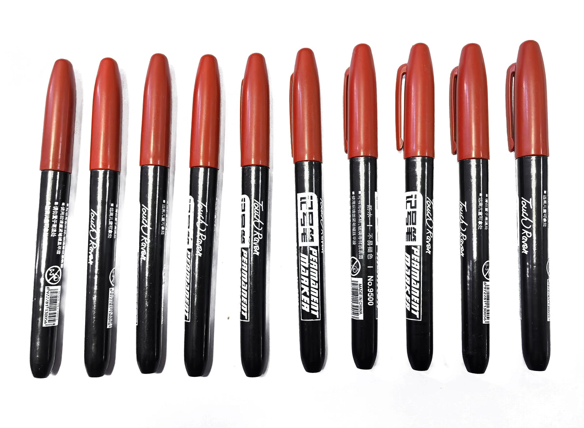 A pack of six black permanent fine-tip markers with orange and red caps arranged in a row.