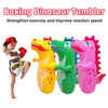 Three inflatable dinosaur tumblers in yellow, green, and pink used for exercise and reaction speed training.