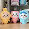 Three plush keychains in yellow, pink, and blue with a sleepy face design.