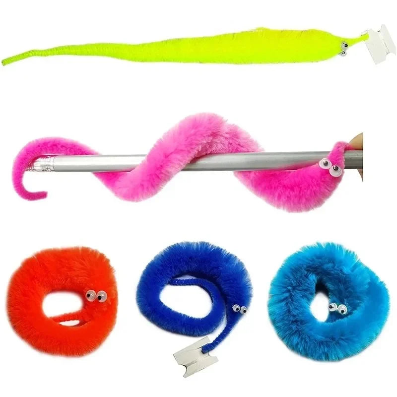 A set of magic worm party trick toys featuring bright yellow, pink, and blue fuzzy worms on a string.