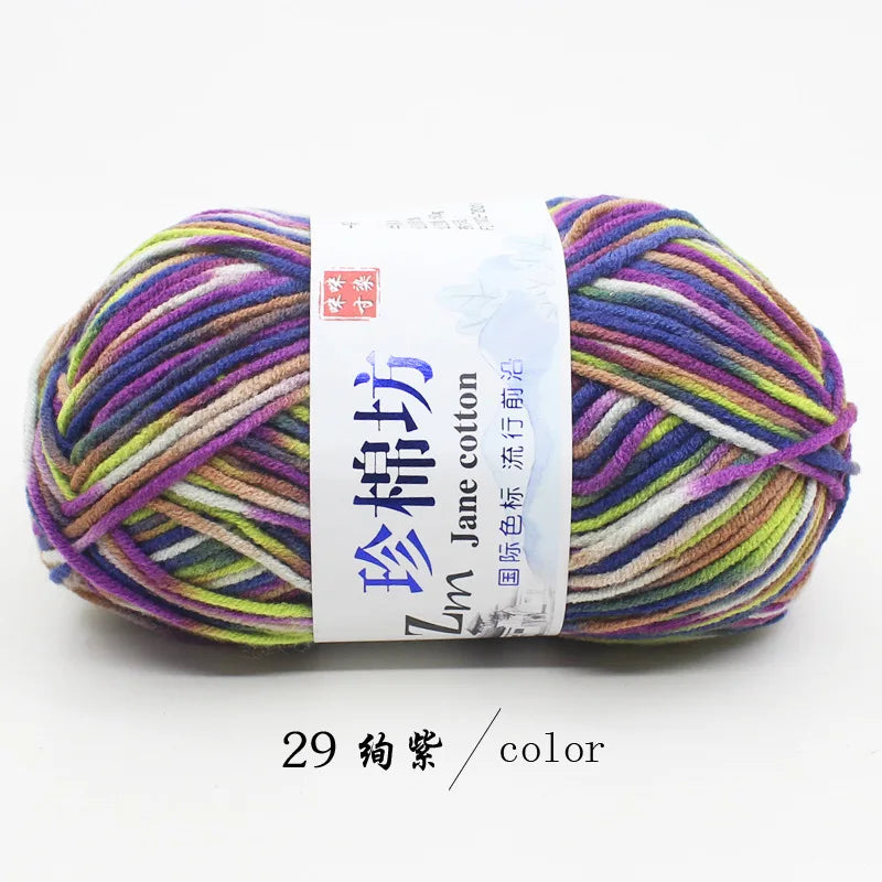 A skein of multi-colored yarn labeled as Jin Jane cotton yarn for knitting and crochet