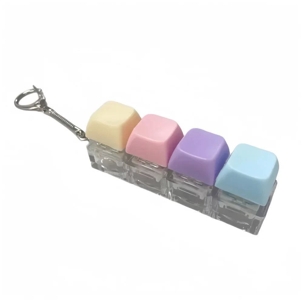 A clear acrylic clicking keyboard fidget toy with pastel colored keys and a metal keychain.
