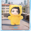 A yellow cat-eared plush toy with black hair and a blind box pendant is displayed outdoors.