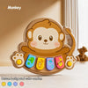 A round, brown monkey-shaped button toy with colorful accents and a handle.