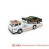 A 1:64 die-cast metal container trailer truck set with pull-back action featuring a black and orange pickup truck.