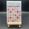 A box of Le Zhi stickers featuring various red and pink patterned designs for crafting