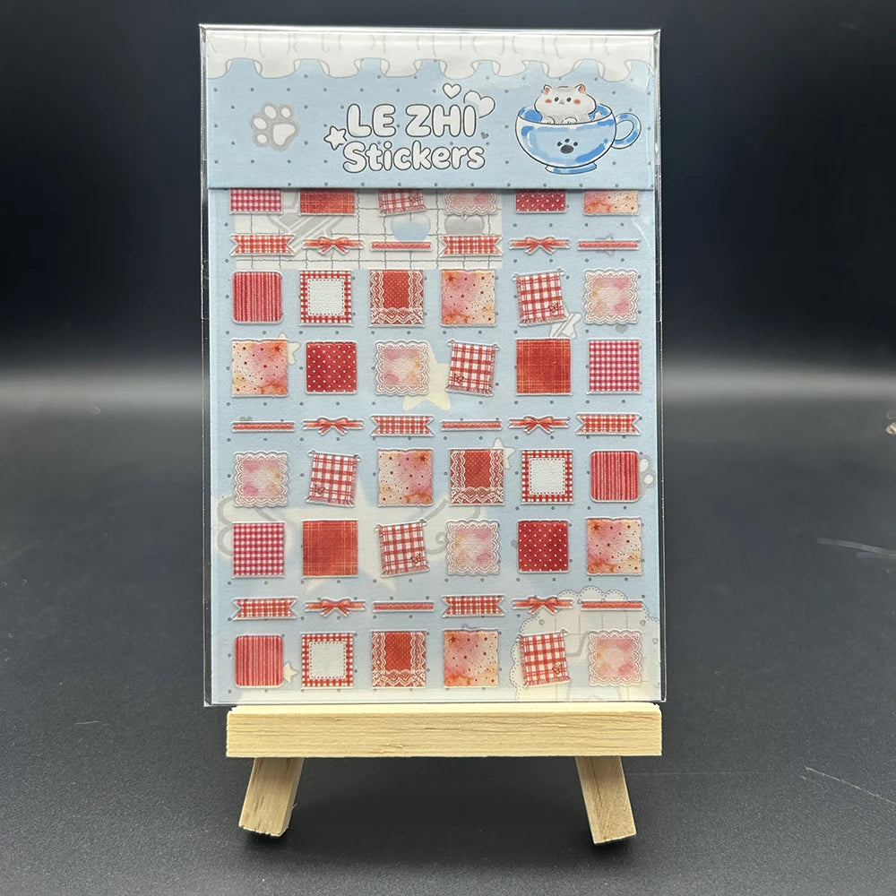 A box of Le Zhi stickers featuring various patterns and designs for crafting and journaling.