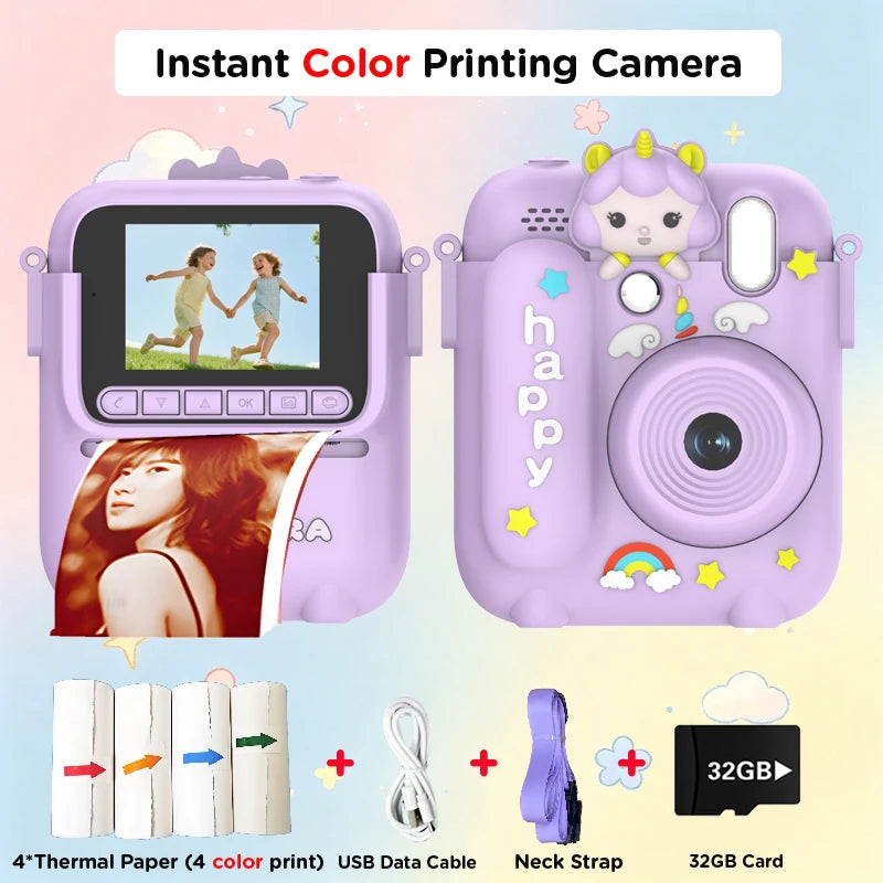A pink instant color printing camera with a lens, paper, USB cable, and 32GB card visible.