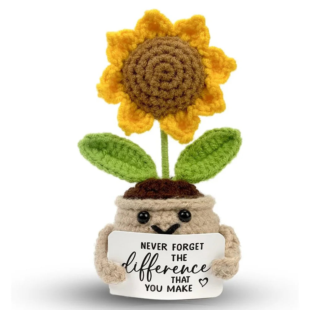 Handmade crochet sunflower pot doll with green leaves and a smiling face
