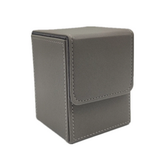 A gray premium leather deck box designed to hold trading cards.