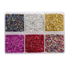 A clear plastic tray filled with various colors of crushed glass stones for resin and craft projects.