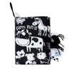 A black cloth book featuring farm animal illustrations like a cow and horse for sensory play.