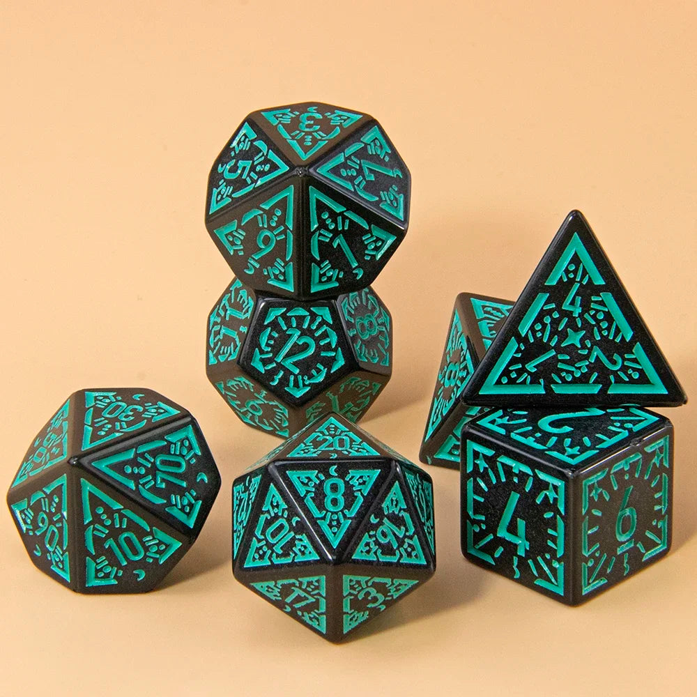 A set of seven polyhedral dice in black and teal are displayed on a light brown surface.