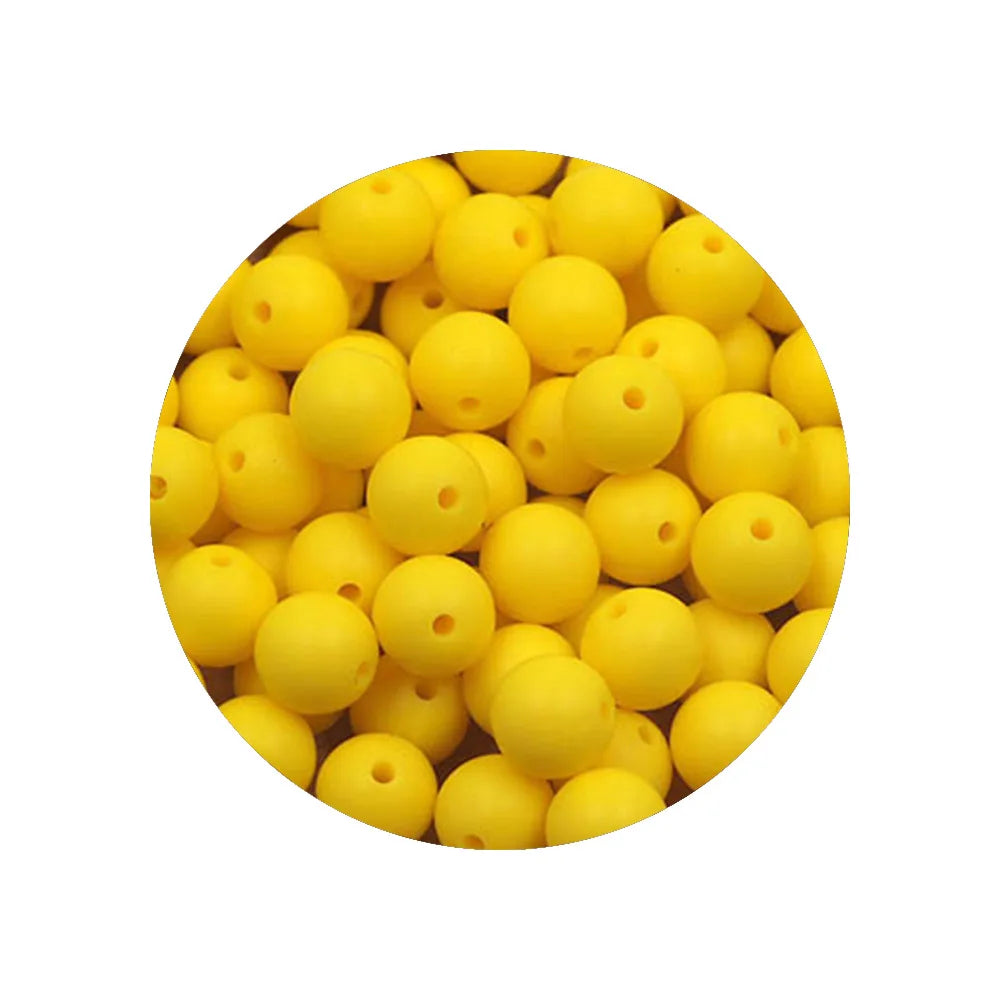 A pile of yellow silicone beads for DIY jewelry making