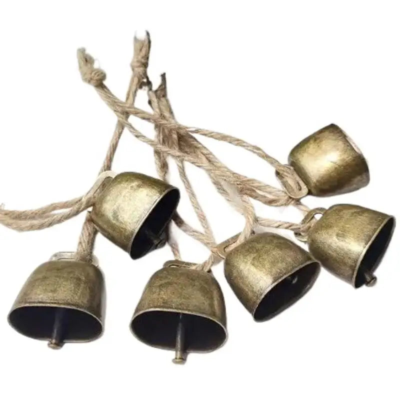 Rustic copper jingle bells with hemp rope used for Christmas decor or pet collars