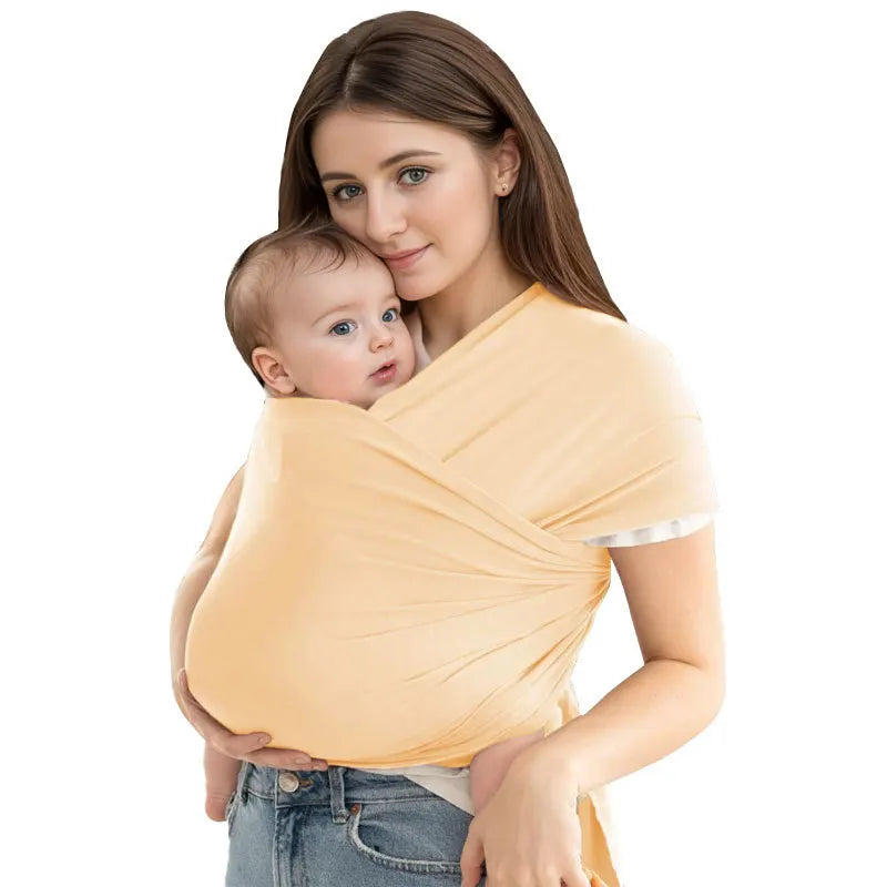 A woman is holding a baby in an ergonomic multi-functional baby sling carrier.