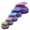 A stack of multi-size paper hole punches in various shades of purple and blue.