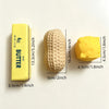 A yellow butter squeeze stress relief food-shaped squishy toy shown next to a rectangular yellow butter bar.