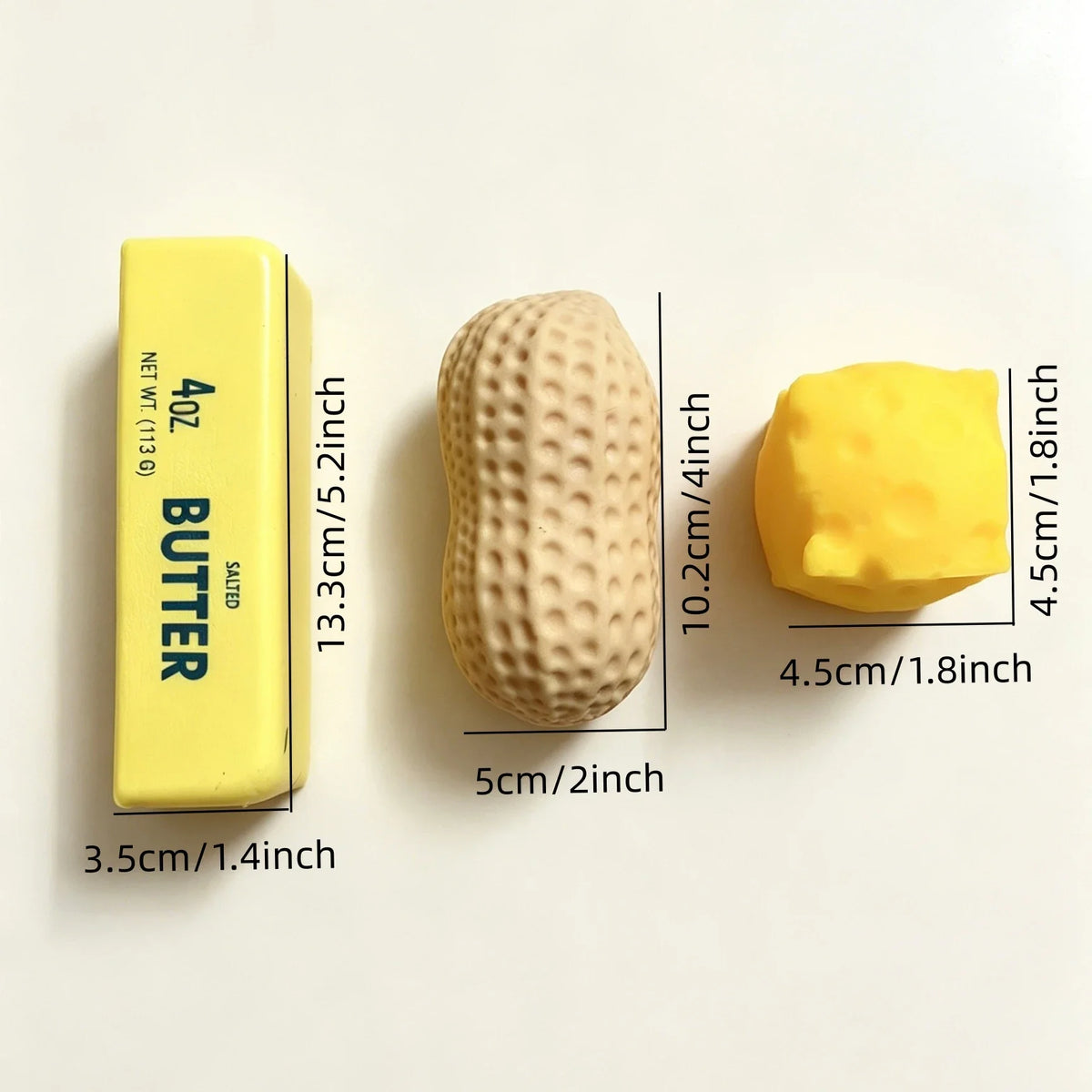 A yellow butter squeeze stress relief food-shaped squishy toy shown next to a rectangular yellow butter bar.