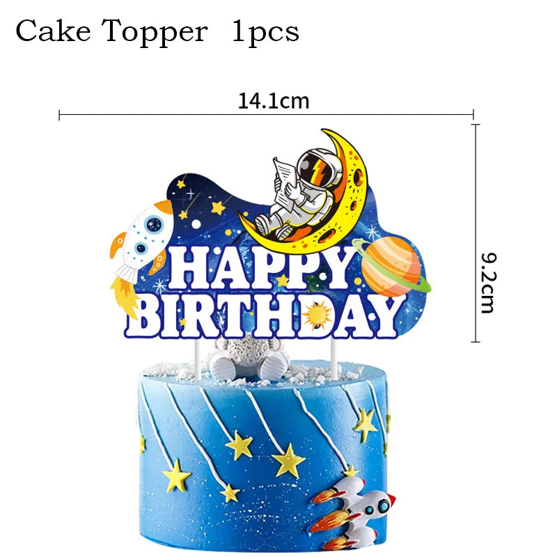 A cake topper featuring an outer space astronaut on a moon background with the text HAPPY BIRTHDAY