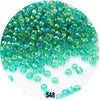 A pile of colorful round loose Czech glass seed beads for jewelry making.
