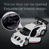 A white Porsche 911 GT3 RS diecast model car is shown with its door open, highlighting the exquisite interior design.