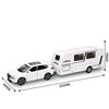 White diecast metal RV camper truck model with sound and light features shown from the side.