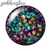 A round glass cabochon featuring colorful butterflies and floral designs for jewelry making.